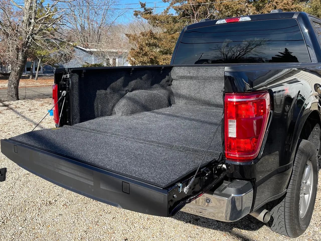 Ford F-150 bed fitted with a drop-in bed liner, tailgate down